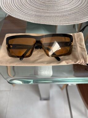 CHANEL Black Frame Sunglasses with Gold Accents